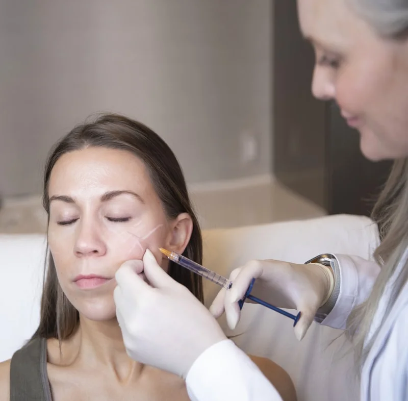 Experienced dermal filler injector performing facial filler treatment at Cosmetic Skin and Laser Center