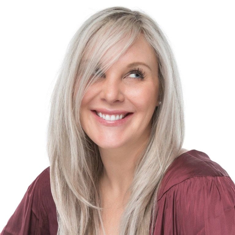 Woman with glowing skin enjoying a holiday evening in Downtown Naples near Fifth Avenue South